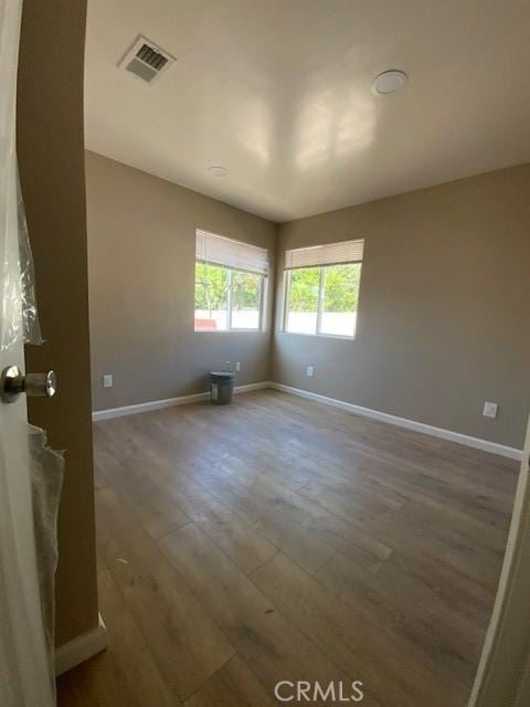 840 W 27th St, San Bernardino, CA 92405 - spare room featuring wood finished floors and baseboards