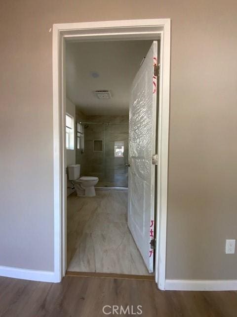 840 W 27th St, San Bernardino, CA 92405 - full bathroom with a shower and wood finished floors