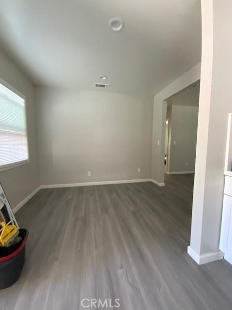 840 W 27th St, San Bernardino, CA 92405 - unfurnished living room with wood finished floors and baseboards