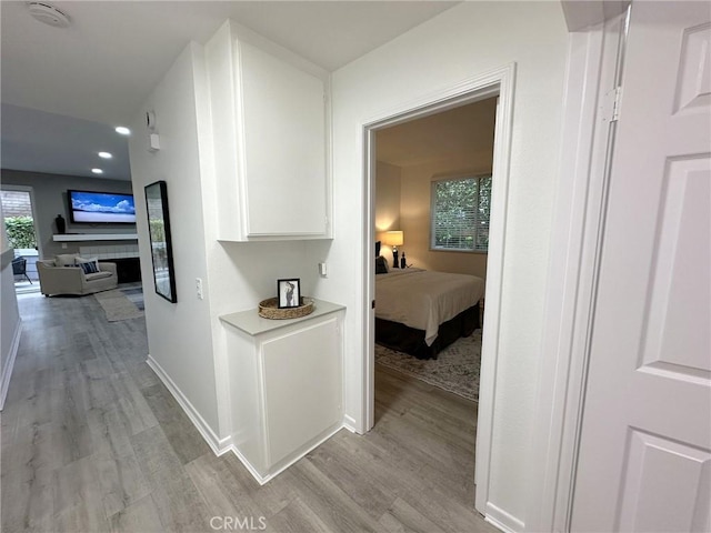 19311 Sunray Ln Unit 104, Huntington Beach, CA 92648 - corridor featuring light wood finished floors and recessed lighting