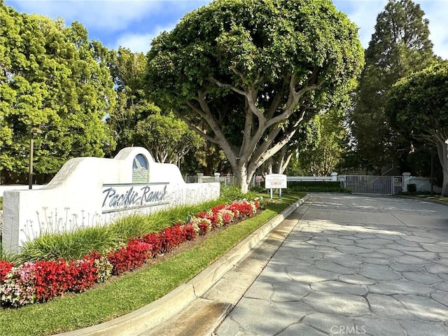 19311 Sunray Ln Unit 104, Huntington Beach, CA 92648 - community sign featuring view of wooded area