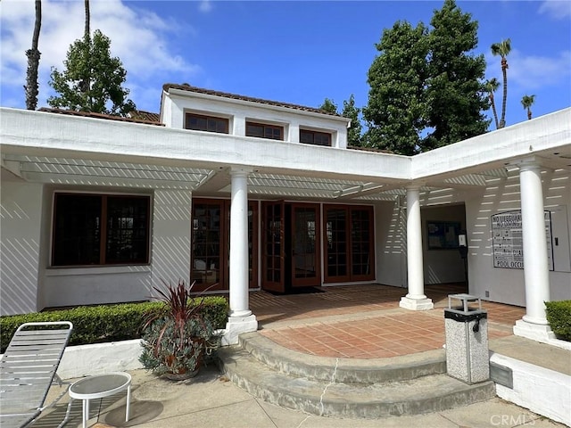 19311 Sunray Ln Unit 104, Huntington Beach, CA 92648 - doorway to property featuring french doors and a patio area
