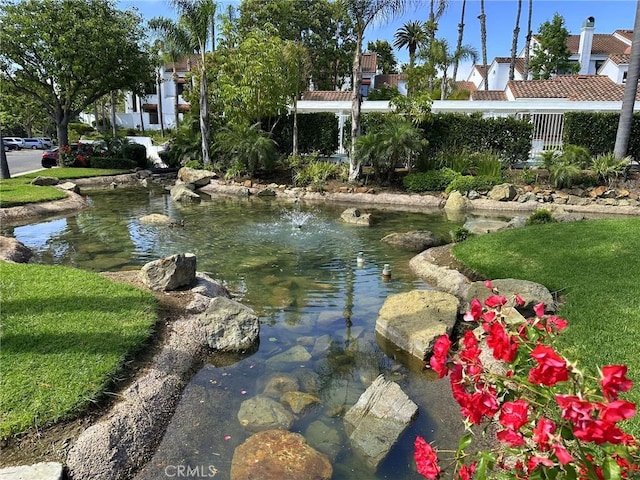 19311 Sunray Ln Unit 104, Huntington Beach, CA 92648 - water view with a garden pond