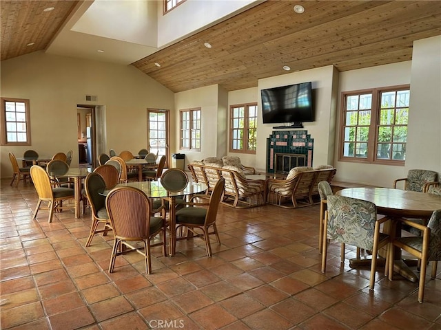 19311 Sunray Ln Unit 104, Huntington Beach, CA 92648 - tiled dining space featuring lofted ceiling, a fireplace, recessed lighting, and wooden ceiling