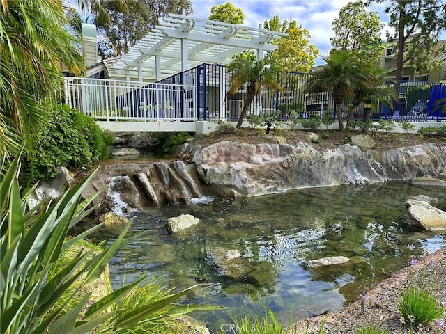 19311 Sunray Ln Unit 104, Huntington Beach, CA 92648 - rear view of property with a pergola