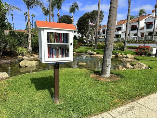 19311 Sunray Ln Unit 104, Huntington Beach, CA 92648 - view of community featuring a yard and a residential view