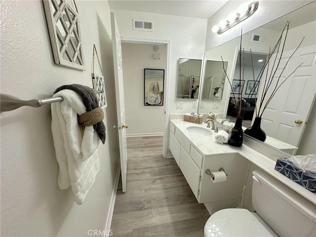 19311 Sunray Ln Unit 104, Huntington Beach, CA 92648 - bathroom featuring wood finished floors and vanity