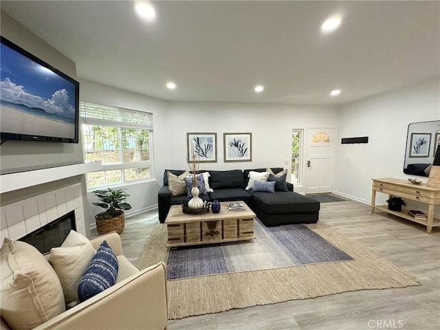 19311 Sunray Ln Unit 104, Huntington Beach, CA 92648 - living area with recessed lighting, wood finished floors, and a tile fireplace
