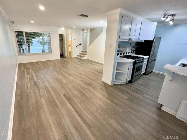 11138 Aqua Vista St Unit 3, Studio City, CA 91602 - kitchen featuring appliances with stainless steel finishes, wood finished floors, ornamental molding, recessed lighting, and white cabinetry