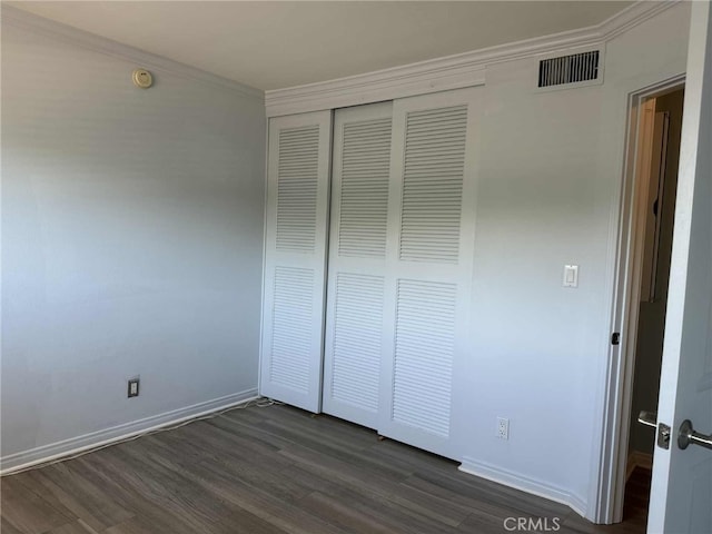 11138 Aqua Vista St Unit 3, Studio City, CA 91602 - unfurnished bedroom with dark wood finished floors, a closet, and crown molding