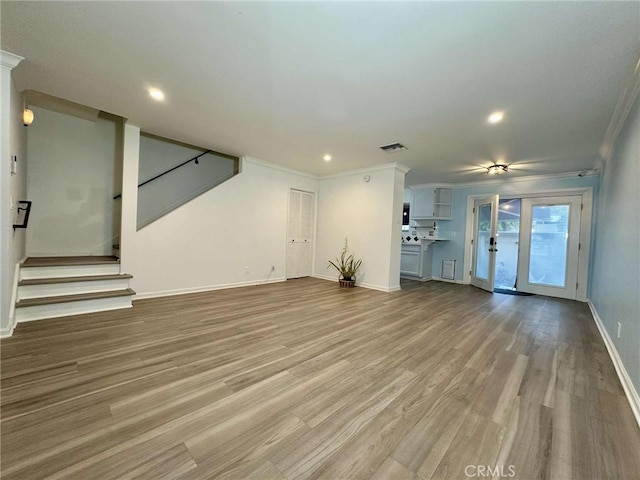 11138 Aqua Vista St Unit 3, Studio City, CA 91602 - unfurnished living room with ornamental molding, recessed lighting, wood finished floors, and stairway