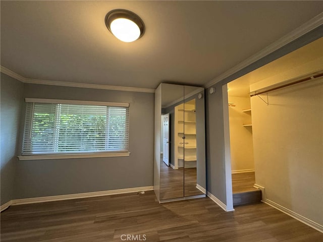 11138 Aqua Vista St Unit 3, Studio City, CA 91602 - unfurnished bedroom featuring crown molding and dark wood-style floors