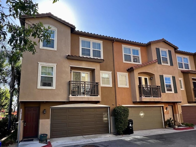 506 62nd St Unit 5, San Diego, CA 92114 - mediterranean / spanish-style house featuring stucco siding, a tiled roof, and an attached garage
