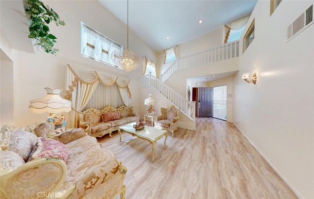 220 S Linhaven Cir, Anaheim, CA 92804 - living area featuring a high ceiling, stairway, a chandelier, and wood finished floors