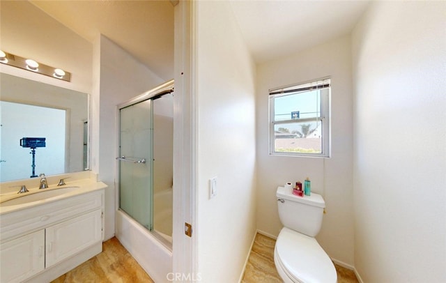 220 S Linhaven Cir, Anaheim, CA 92804 - full bathroom with vanity, shower / bath combination with glass door, and wood finished floors