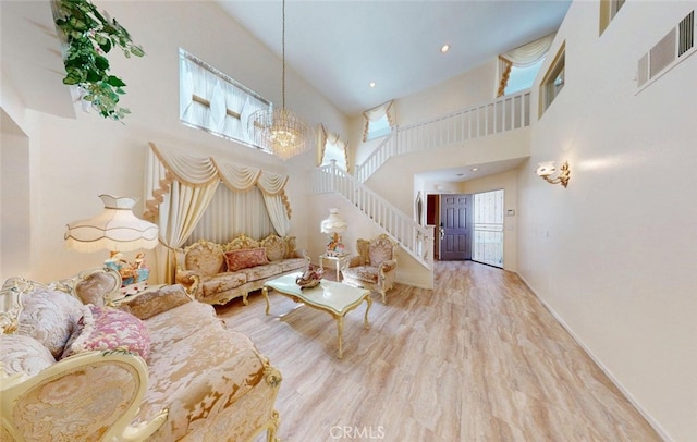220 S Linhaven Cir, Anaheim, CA 92804 - living room with a high ceiling, stairway, a chandelier, and wood finished floors