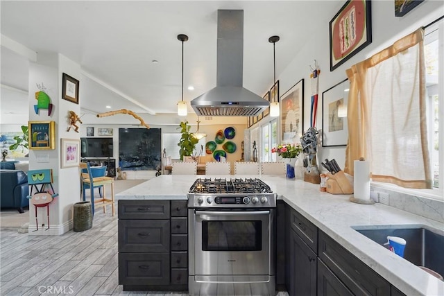 1909 Arroyo Ave, Oceanside, CA 92056 - kitchen with island range hood, stainless steel gas range, open floor plan, a peninsula, and light stone counters