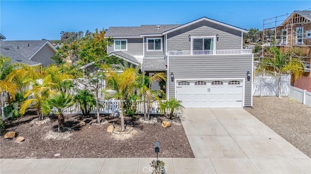1909 Arroyo Ave, Oceanside, CA 92056 - view of front of home with a balcony, concrete driveway, and a garage