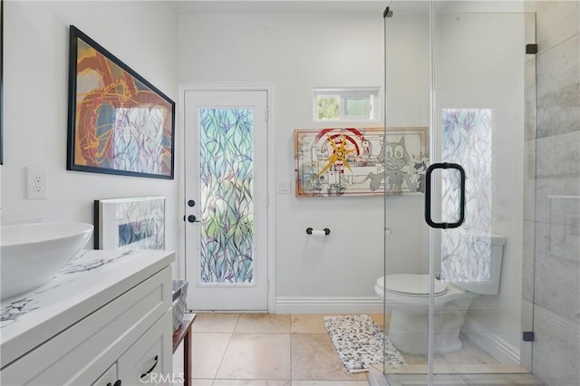 1909 Arroyo Ave, Oceanside, CA 92056 - bathroom featuring vanity, tiled shower, and tile patterned flooring