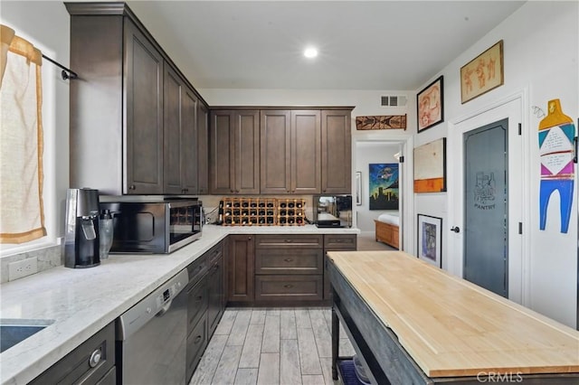 1909 Arroyo Ave, Oceanside, CA 92056 - kitchen with black microwave, dishwasher, dark brown cabinetry, and tasteful backsplash