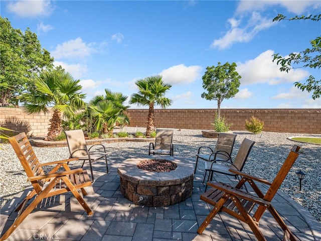 27239 Peach Tree Ln, Helendale, CA 92342 - fenced backyard featuring a fire pit and a patio area