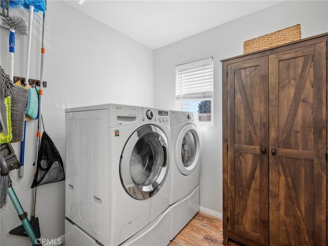 27239 Peach Tree Ln, Helendale, CA 92342 - laundry area with separate washer and dryer and light wood finished floors