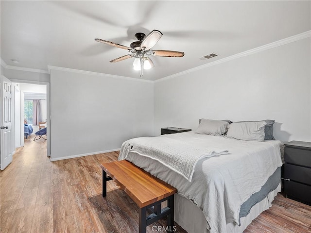 27239 Peach Tree Ln, Helendale, CA 92342 - bedroom featuring wood finished floors, crown molding, and a ceiling fan