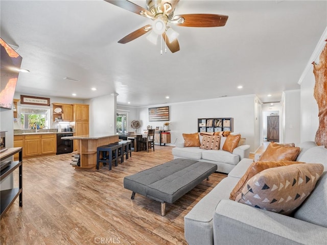 27239 Peach Tree Ln, Helendale, CA 92342 - living room with healthy amount of natural light, light wood-style floors, ceiling fan, crown molding, and recessed lighting
