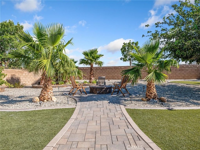 27239 Peach Tree Ln, Helendale, CA 92342 - view of patio with an outdoor fire pit