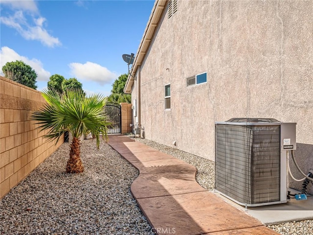 27239 Peach Tree Ln, Helendale, CA 92342 - view of home's exterior with stucco siding and a gate