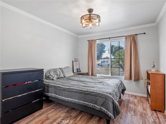 27239 Peach Tree Ln, Helendale, CA 92342 - bedroom featuring wood finished floors, ornamental molding, and a chandelier