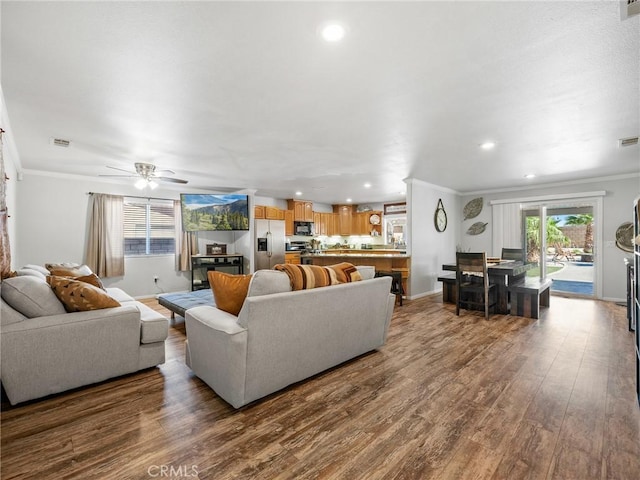 27239 Peach Tree Ln, Helendale, CA 92342 - living area featuring ornamental molding, dark wood-type flooring, recessed lighting, and a ceiling fan