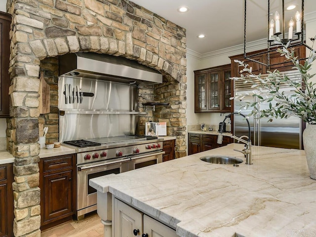 32110 Dos Ninas, Bonsall, CA 92003 - kitchen with range with two ovens, exhaust hood, ornamental molding, light stone countertops, and glass insert cabinets
