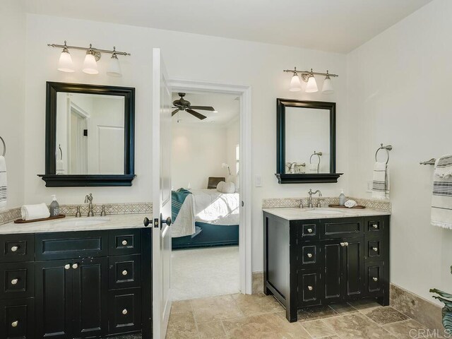 32110 Dos Ninas, Bonsall, CA 92003 - full bathroom featuring ensuite bath, two vanities, a ceiling fan, and stone finish floors