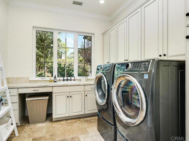 32110 Dos Ninas, Bonsall, CA 92003 - washroom with washing machine and dryer, cabinet space, ornamental molding, light stone finish flooring, and recessed lighting