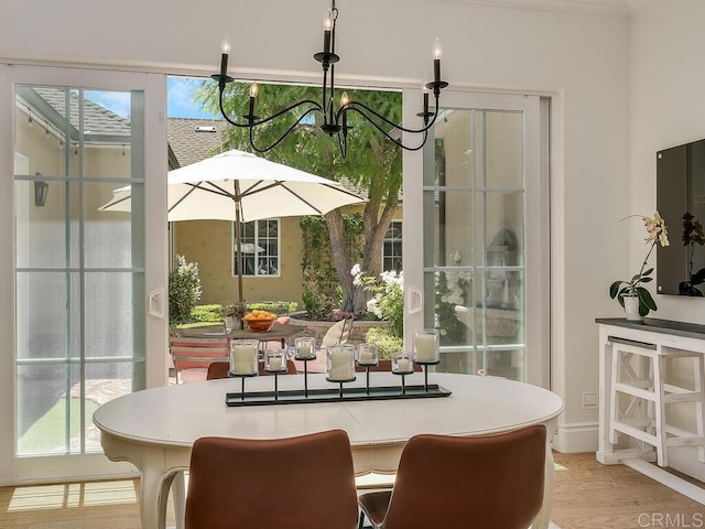 32110 Dos Ninas, Bonsall, CA 92003 - dining space featuring a chandelier, plenty of natural light, and wood finished floors