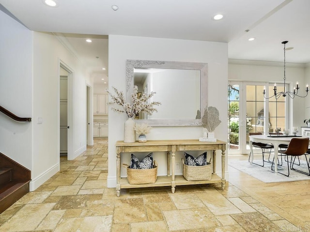 32110 Dos Ninas, Bonsall, CA 92003 - hall featuring crown molding, stone tile flooring, recessed lighting, stairs, and a chandelier