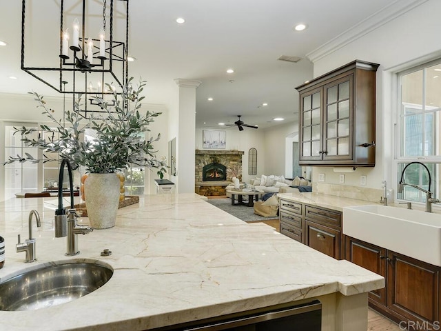 32110 Dos Ninas, Bonsall, CA 92003 - kitchen with a ceiling fan, recessed lighting, healthy amount of natural light, a fireplace, and ornamental molding