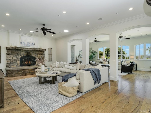 32110 Dos Ninas, Bonsall, CA 92003 - living area with a ceiling fan, arched walkways, light wood finished floors, recessed lighting, and ornamental molding