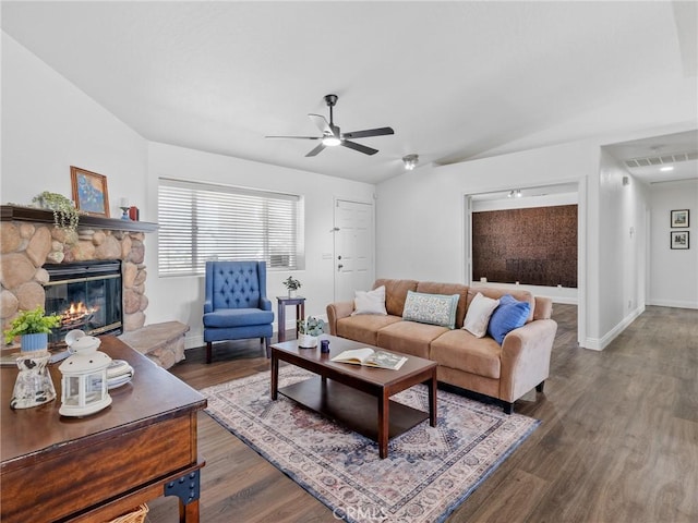 22163 Broken Lance Rd, Apple Valley, CA 92307 - living room with a ceiling fan, a stone fireplace, and wood finished floors