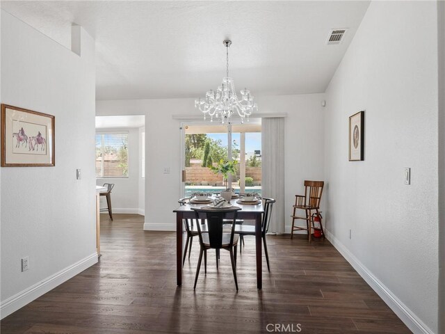 22163 Broken Lance Rd, Apple Valley, CA 92307 - dining area featuring dark wood-style floors and a chandelier