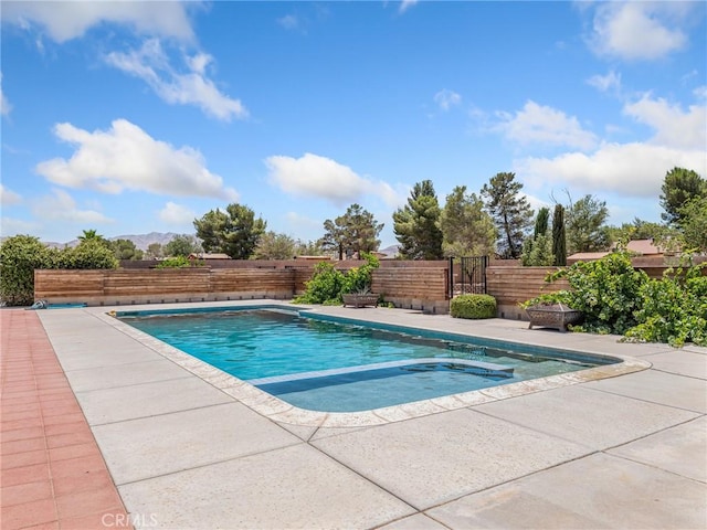 22163 Broken Lance Rd, Apple Valley, CA 92307 - view of pool featuring a fenced backyard, a patio area, and a pool with connected hot tub