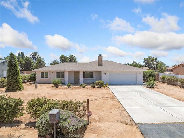22163 Broken Lance Rd, Apple Valley, CA 92307 - ranch-style home featuring concrete driveway, an attached garage, and a chimney