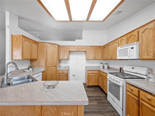 22163 Broken Lance Rd, Apple Valley, CA 92307 - kitchen with white appliances, dark wood finished floors, a peninsula, and light countertops
