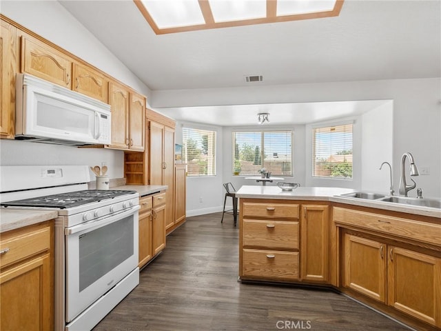 22163 Broken Lance Rd, Apple Valley, CA 92307 - kitchen featuring white appliances, light countertops, and dark wood-type flooring