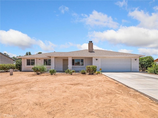 22163 Broken Lance Rd, Apple Valley, CA 92307 - single story home with concrete driveway, an attached garage, a chimney, and a porch