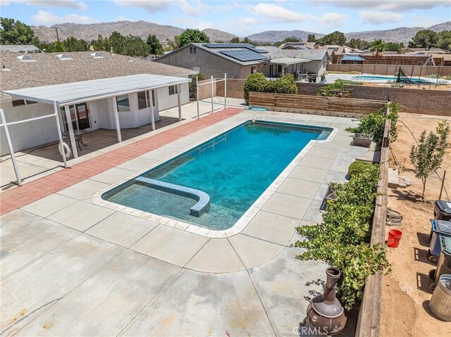 22163 Broken Lance Rd, Apple Valley, CA 92307 - view of swimming pool featuring a mountain view, a fenced backyard, and a patio