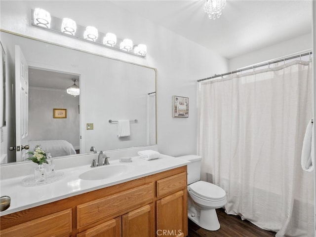 22163 Broken Lance Rd, Apple Valley, CA 92307 - ensuite bathroom with wood finished floors, vanity, and curtained shower