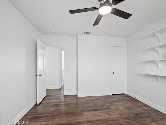 22163 Broken Lance Rd, Apple Valley, CA 92307 - unfurnished bedroom featuring dark wood-style floors and ceiling fan