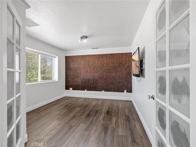 22163 Broken Lance Rd, Apple Valley, CA 92307 - empty room featuring wood finished floors, french doors, ornamental molding, and a textured ceiling